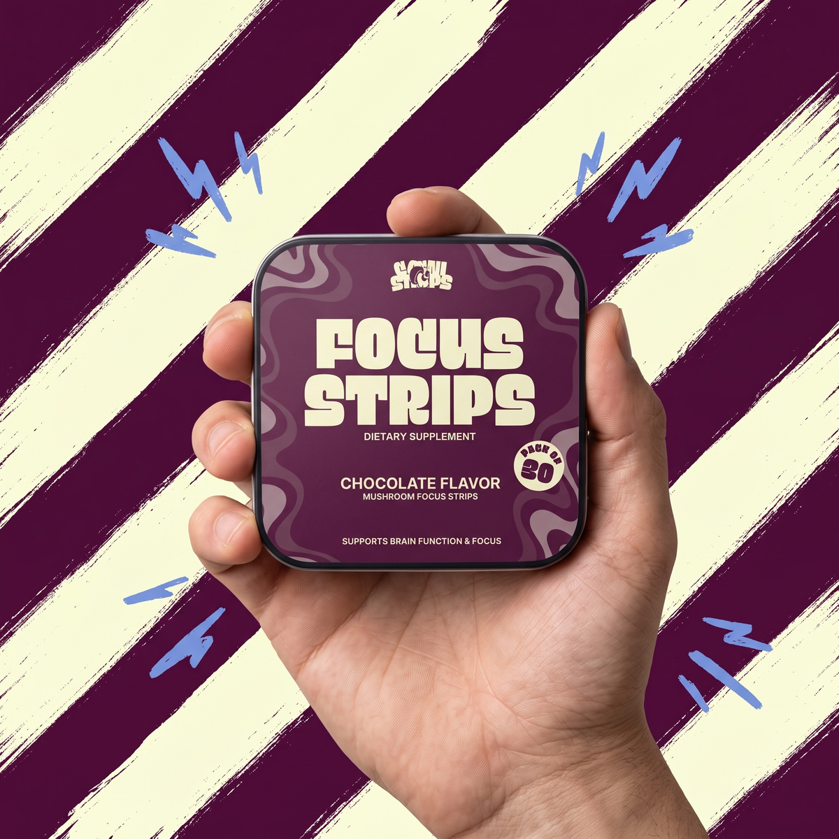 Hand holding a tin of CogniStrips Focus Strips