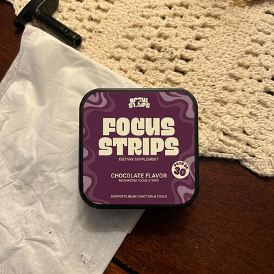 CogniStrips customer holding a tin of Focus Strips
