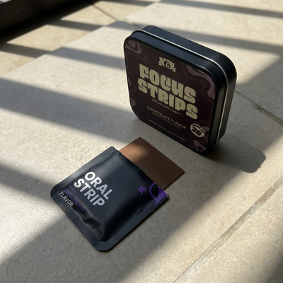 CogniStrips customer holding a tin of Focus Strips